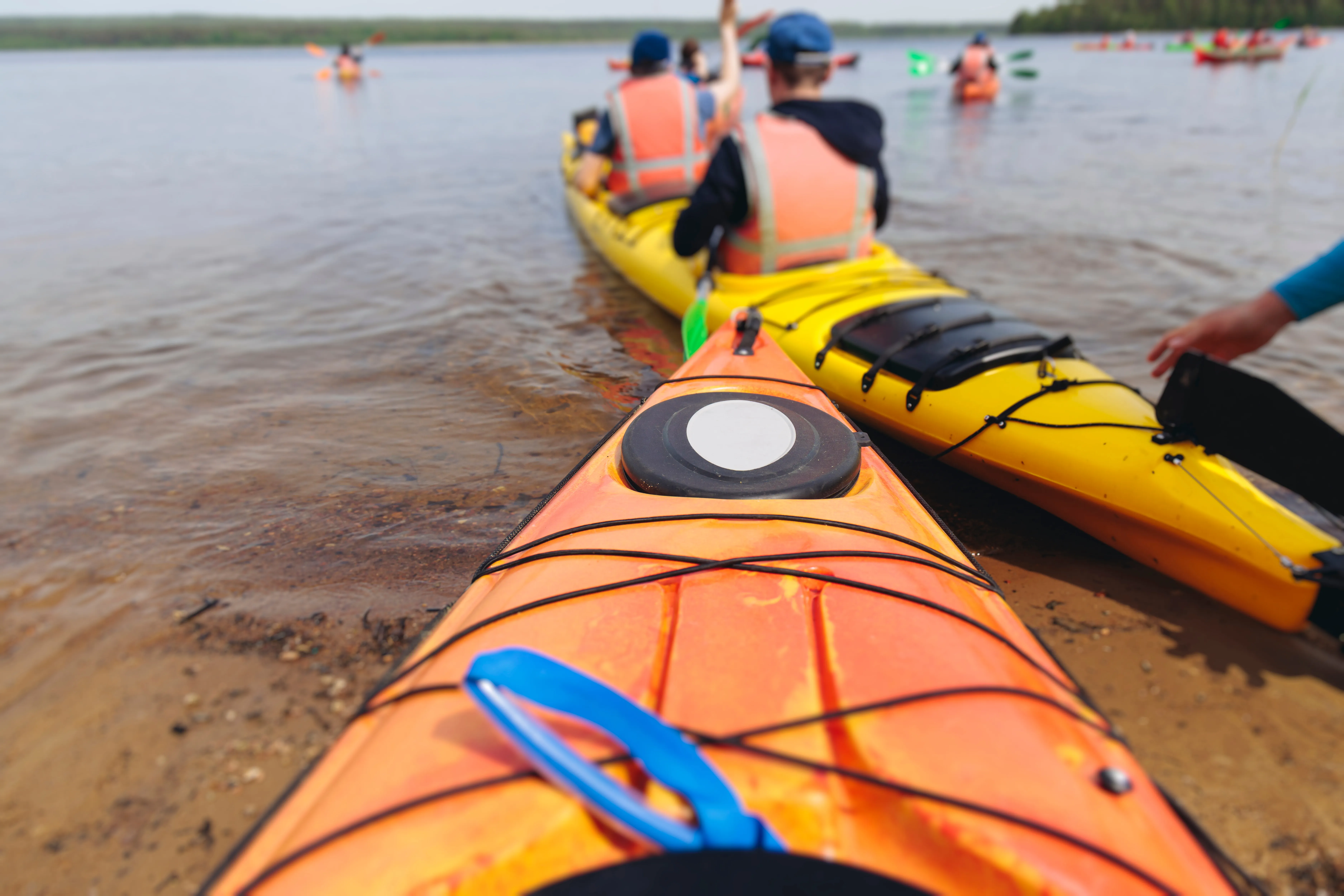 Kayak tour group launching from shore